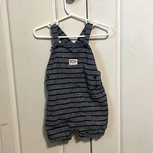 Dark blue/grey blue shorts romper with buttons and ‘daddy’s copilot’ logo.